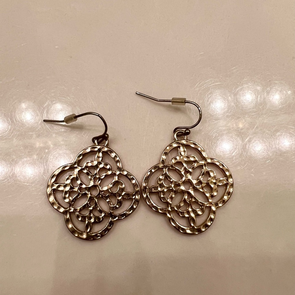 Gold earrings. These were purchased from a boutique. 1 inch wide, 1 inch long.